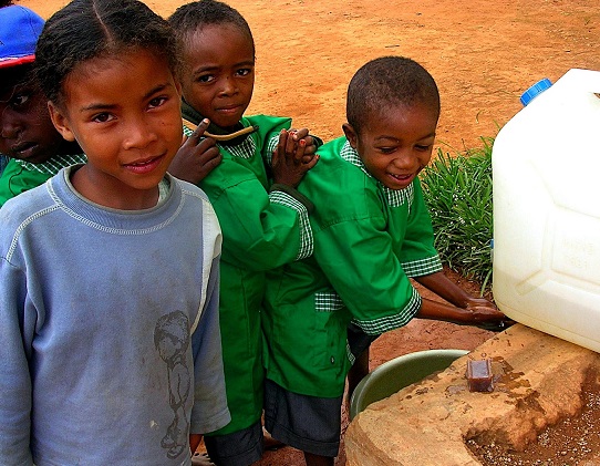 school-kids-in-madagascar-wash-their-hands-with-soap-at-a-portable-hand-washing-station