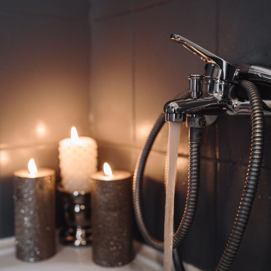 Bath with dim lights and candles