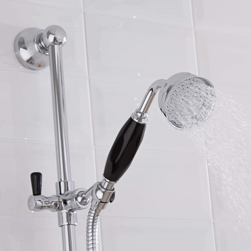 water flowing from a black-handled hand shower