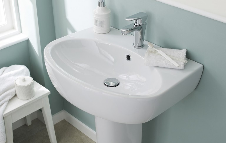 Pedestal basin with waste and tap - close up