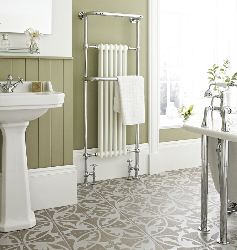 Green traditional bathroom with vintage style towel rail and sink