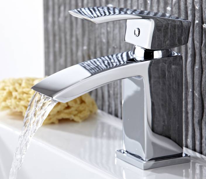 modern chrome basin tap with water pouring from spout modern chrome basin tap with water pouring from spout