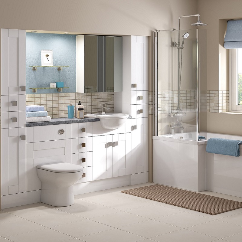 Clean modern bathroom layout with toilet, sink, shower/bath combo and in-built units