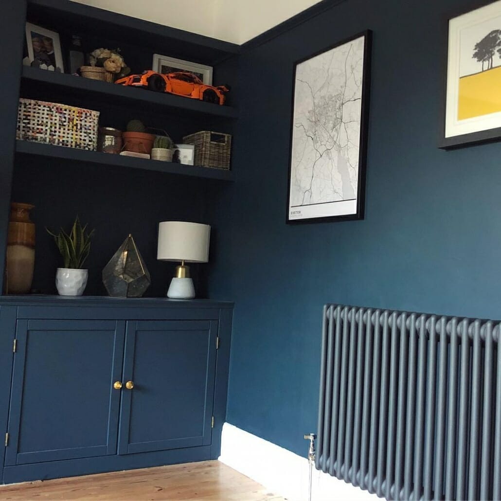 a blue living room with a blue radiator