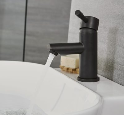 Milano Nero deckmounted basin tap in operation