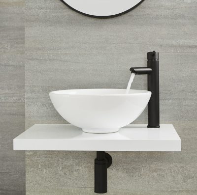 Milano Nero tall deck mounted basin tap in operation