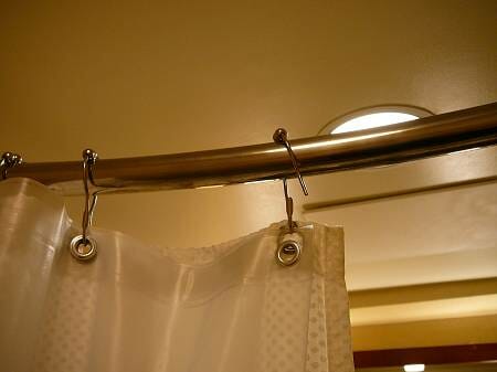 A close up of the top of a shower curtain