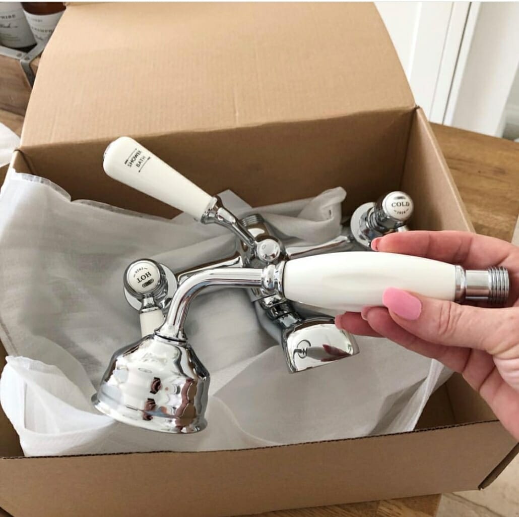 Sally opening the box f brassware she got from Big Bathroom Shop