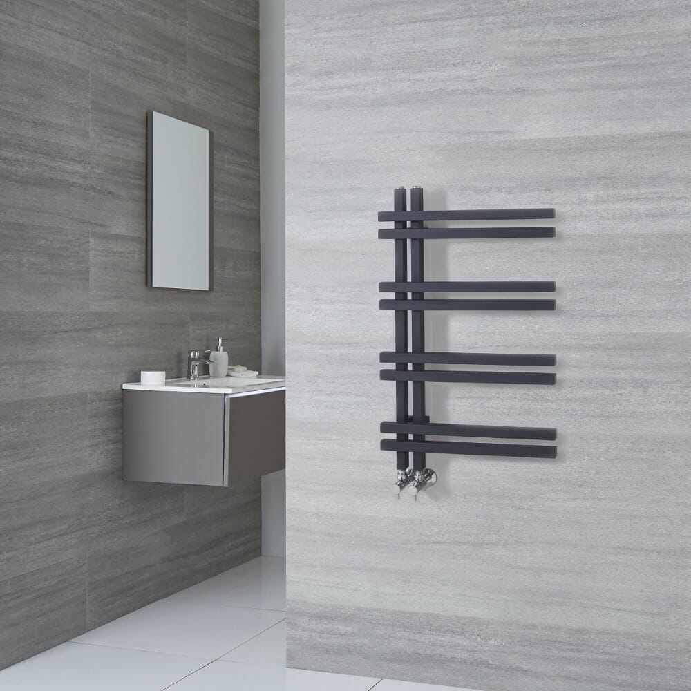 a modern heated towel rail in an en-suite bathroom
