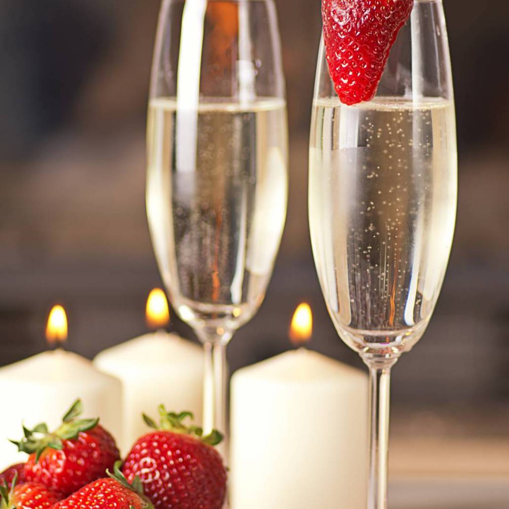 glasses of sparkling wine with strawberries in