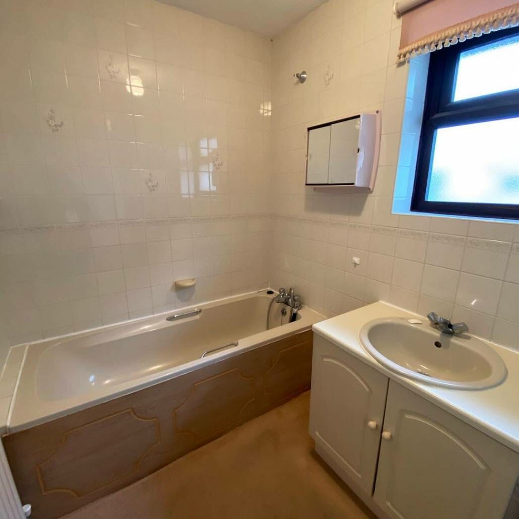 Old bathroom suite with bath