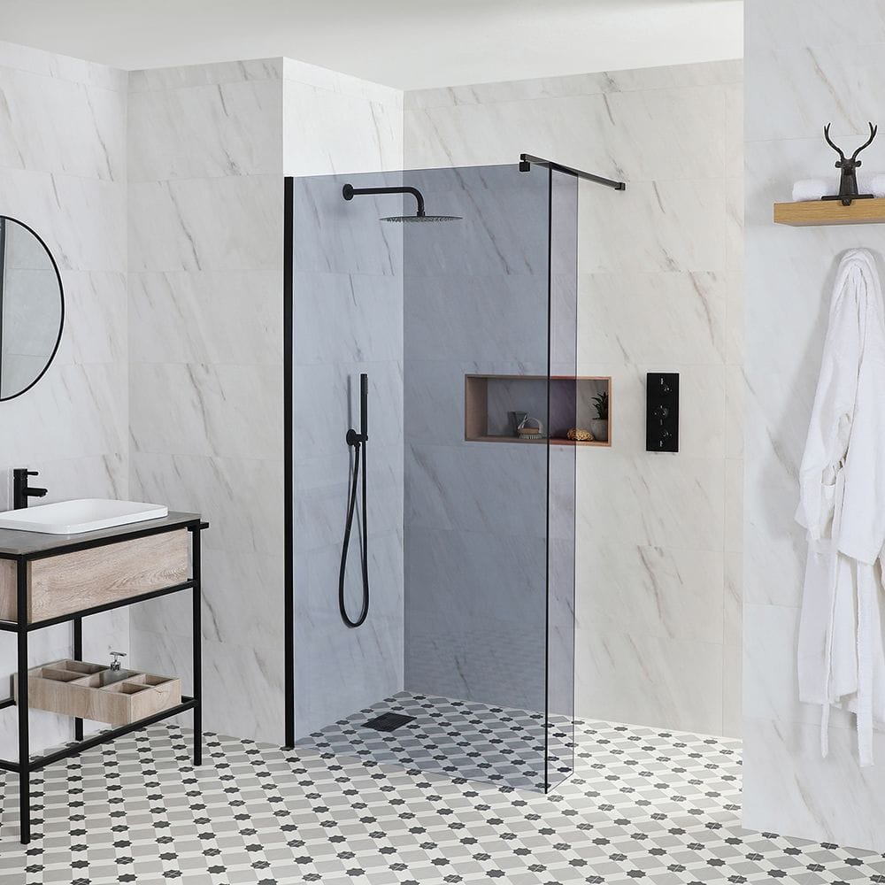 A smoked glass Milano Nero luna wet room with a black and white tiled floor - modern bathroom space