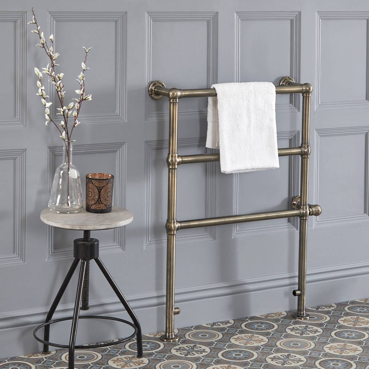 traditionally styled electric heated towel rail with a brushed gold finish