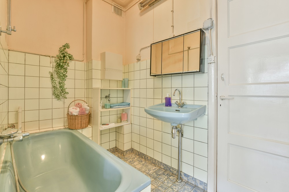 a dated bathroom in need of a renovation