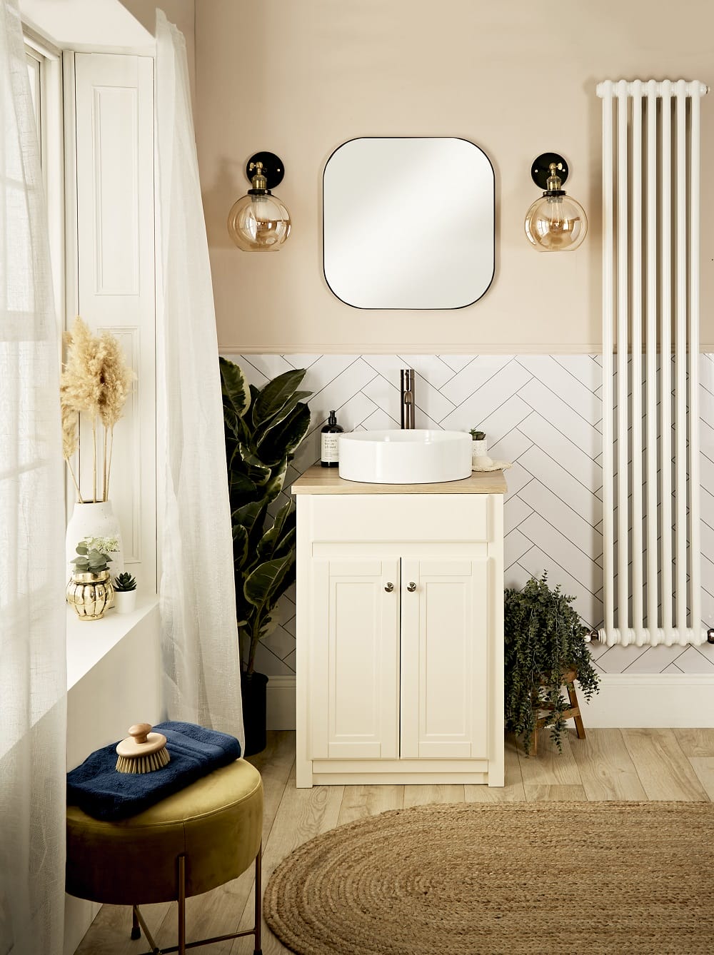 a cottagecore style wash space with a vertical radiator to the right of the basin 