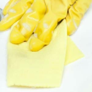yellow kitchen glove cleaning with cloth